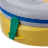 a close up view of the green tab located on the yellow pad-pak to the trainer unit 