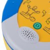 Closeup of the speaker on a heartsine 360p trainer unit showing part of the yellow and blue casing with icons