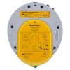 a back view of the trainer unit mimicking the HeartSine 500P. Showing the bright yellow training pad-pak with instructions on where to place them on a patient