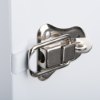 Close-up of a metal latch on a heartsine white internal cabinet showing the locking mechanism