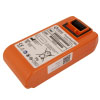 A bright orange replacement defibrillator battery