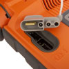 A close-up of the pad connector port on a bright orange defibrillator