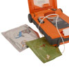 A bright orange defibrillator with a set of electrode pads and CPR pads