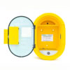 A yellow defibrillator cabinet with the door open