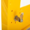Closeup of lock on polycarbonate outdoor defibrillator cabinet heating light yellow showing metal latch and yellow surface