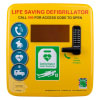 front of a yellow plastic square shaped cabinet there is a black numbered code lock with a handle. There are 4 blue infographics showing the chain of survival for a sca victim