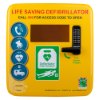 Front view of a yellow polycarbonate outdoor defibrillator cabinet lock heating unit with keypad and signage