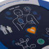 A close-up of the defibrillator screen and buttons