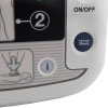A close-up of the blue "automatic shock" button