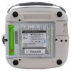 The back of a white defibrillator with a green label and its serial numbers