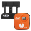 An orange iPAD automated external defibrillator with a heart‑and‑lightning symbol, positioned next to a black wall‑mount bracket labelled AED – Automated External Defibrillator.