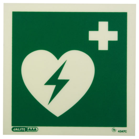 a front shot of the aed location sign with a green heart with a lightening bolt through it with a first aid cross in the top right corner