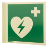 a side view of the panoramic aed wall sign showing one side with a green background, heart with lightening bolt through it and first aid cross