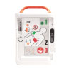  white defibrillator with the lid open showing the internal buttons and user instructions