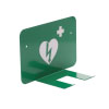 a green metal bracket to hang a defibrillator with a white heat with green lightening logo to denote a defib there is a white cross on the right of the heart to denote a piece of first aid equipment
