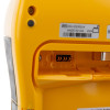 A close-up of the battery slot on a yellow and black defibrillator