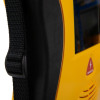 A close-up of the handle on a yellow and black defibrillator