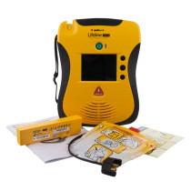 A yellow and black defibrillator with all of its contents