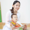 a mother with a child reading a book
