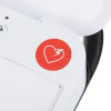 a close up view of the red shock button located at the top of the trainer unit when the lid is opened