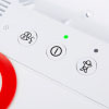 a close up view of the action buttons, power button with green indicator led above, language button and child mode button with another led indicator for when it has been activated