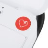 Closeup of a red heart-shaped button on a physio control likepak cr2 trainer unit