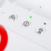 Closeup of indicator buttons and lights on the physio control likepak cr2 trainer unit showing power and function icons