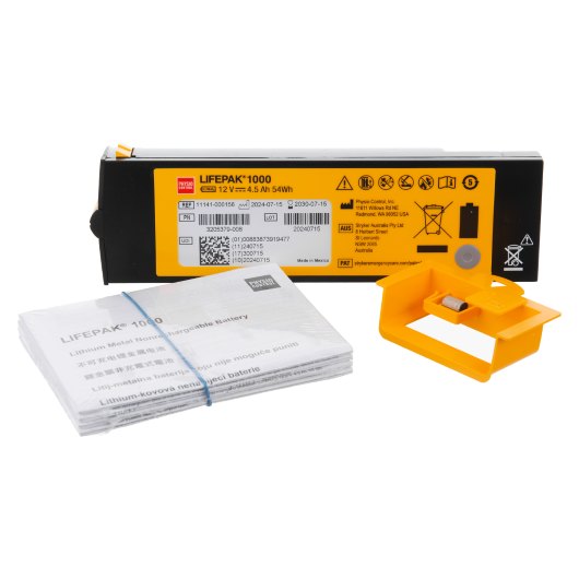 physio control lifepak 1000 non rechargeable lithium battery kit showing battery unit, instruction manual, and yellow plastic holder