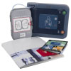 A dark and light blue defibrillator with all of the kit contents