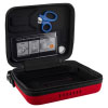 An open defibrillator case with a instructions and a pair of medical scissors