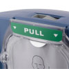 A close-up of the green pull tab on the front of a blue defibrillator