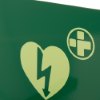 Closeup of the mediana hearton a15 defibrillator wall bracket showing a heart symbol with a lightning bolt on a green background