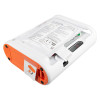 AED interior showing sealed Mediana electrode pads with printed diagrams and a pull‑tab for pad removal.