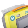 Closeup of a power button on the zoll aed 3 defibrillator full automatic with a yellow casing and orange handle