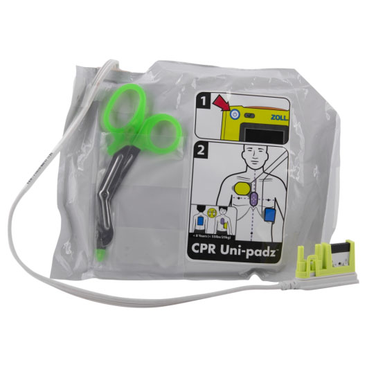 A front shot of the contents of the Zoll AED 3 CPR Uni-padz, including tuff-kutt scissors, instructions on how to place the pads on a patient, adult or child, and showing the green connector plug
