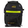 a front shot of the backpack with a shoulder strap at the front. The black backpack has a reflective strip across the middle with yellow text saying AED and branded defibtech