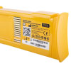 close up shot of a yellow rectangular battery with a qr code for further information, ce marking, manufacturer and address 