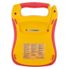 a back view of a trainer defibrillator unit in yellow and red and clear technical information sticker