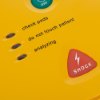 Closeup of indicator lights and shock button on defibtech lifeline aed trainer unit showing check pads do not touch patient and analyzing labels