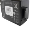 a close up of a square shaped black battery, there is writing grey showing the make and model which is Phillips heartstart, there is the manufactures address and the install begore date shown
