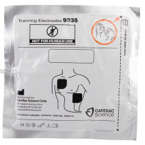 Stjg3Atp Cardiac Science Powerheart G3 Adult Training Electrode Pads In Pack a silver foil square package with a white label with black writing staring they are training electrodes, and the manufacturers name and address. it also has an infographic showing the correct pad placement on the torso