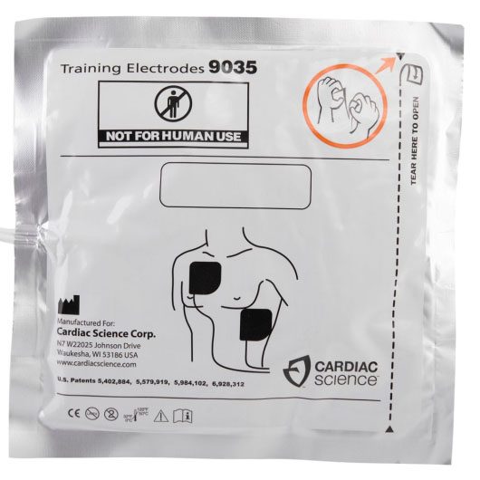 a silver foil square package with a white label with black writing staring they are training electrodes, and the manufacturers name and address. it also has an infographic showing the correct pad placement on the torso 