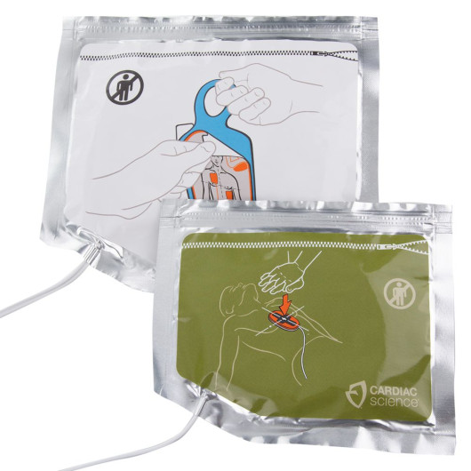 two foil pouches one with a white label showing an infographic of how to remove the adhesive pads from the blue backing plastic, the other foil pouch has a green label with an infographic showing the correct placement of the cpr device