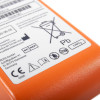 orange block battery with a white label showing the safe disposal, manufacturer name and address
