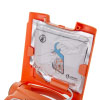 a close up view of the training pads loacted in the lid compartment with pictorial instructions on the packaging