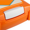 Close-up of a white latch on an orange hard-shell equipment case with a white and blue panel on the lid.