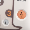 Close-up of an AED device panel showing an orange shock button with a lightning symbol, a white information button, and part of the ON/OFF label