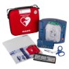 philips heartstart hs1 defibrillator with carry case showing red case blue device instruction manual scissors and accessories laid out