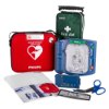 philips heartstart hs1 defibrillator with carry case showing device, red carry case, first aid kit and accessories laid out