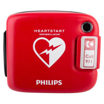 a bright red defibrillator carry case branded with Philips accommodating the HeartStart FRx with a heart logo with a lightening bolt through it. Including an emergency phone number with black handle